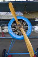 old aircraft engine with wood propeller, vintage plane close up