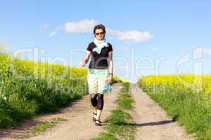 Woman walks alone in nature walk