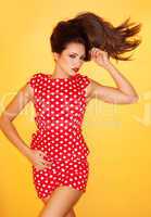 hot woman wearing red polka dots dress with black stiletto