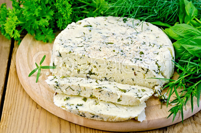 cheese round homemade with herbs chopped