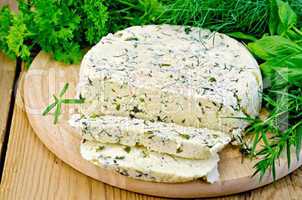 cheese round homemade with herbs chopped