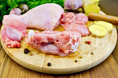 chicken leg cut on a wooden board