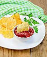 chips with tomato sauce on the board