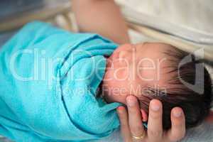 Newborn Asian baby girl in hospital
