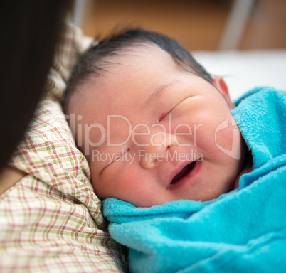 Newborn Asian baby girl and mother