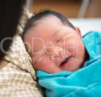 Newborn Asian baby girl and mother