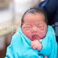 Newborn Asian baby and father