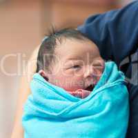 Newborn Asian baby girl and father