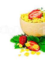 corn flakes in a wooden bowl with strawberries