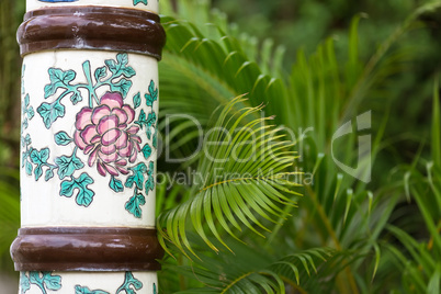 ceramic column and palm tree