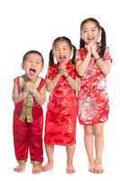 Group of oriental children wishing you a happy Chinese New Year
