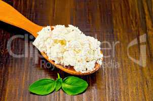 curd in a wooden spoon on the board