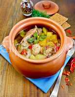 roast chicken in a clay pot with hot pepper