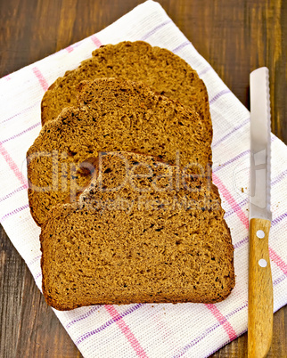 rye bread slices with a knife on a napkin