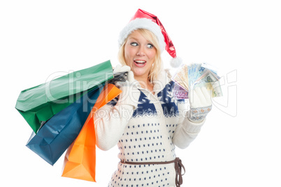 weihnachtsfrau mit geldscheinen beim shopping