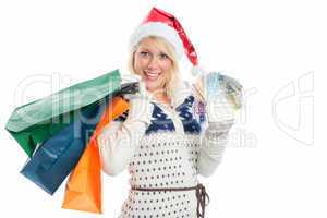 Weihnachtsfrau mit Geldscheinen beim Shopping