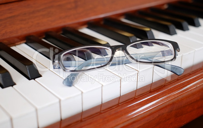 Glasses on a piano
