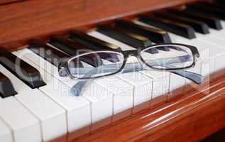 Glasses on a piano