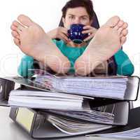 Office woman puts feet up relaxing