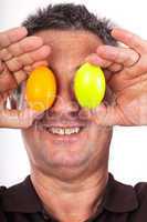 Man holding Easter eggs in front of the eyes