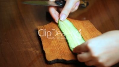 hand making flower from cucumber