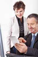 Businessman and businesswoman with tablet PC