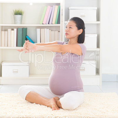 Pregnant woman yoga at home