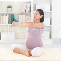 Pregnant woman yoga at home