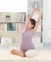 Woman doing relaxation yoga at home