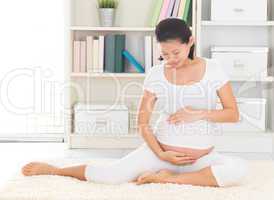 Asian 8 months pregnant woman