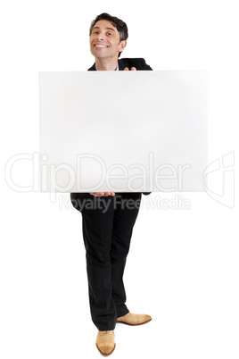 businessman with a toothy grin with a blank sign