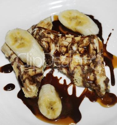 Waffles With Bananas And Chocolate Syrup