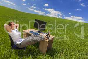Businesswoman Woman Relaxing at Desk In Green Field