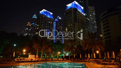 The swimming pool at luxury hotel in night illumination, Dubai, UAE