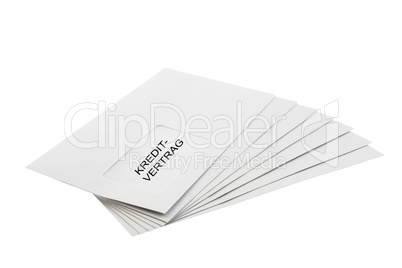 Kreditvertrag on a Batch of Envelopes isolated on White
