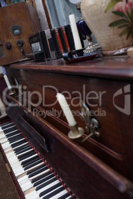 open vintage piano with candles