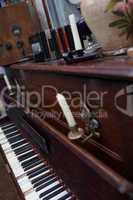 open vintage piano with candles