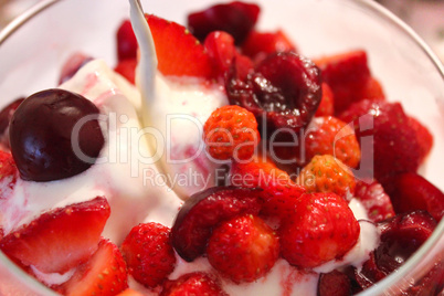 icecream with cherry and wild strawberry