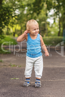 portrait of a happy little boy in the  park.