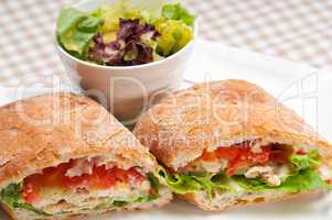 ciabatta panini sandwich with chicken and tomato