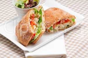 ciabatta panini sandwich with chicken and tomato