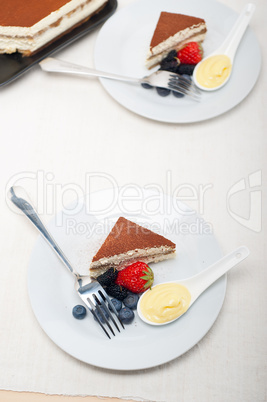 tiramisu dessert with berries and cream