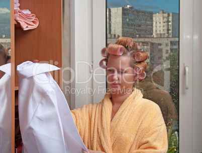 Girl in hair curlers.