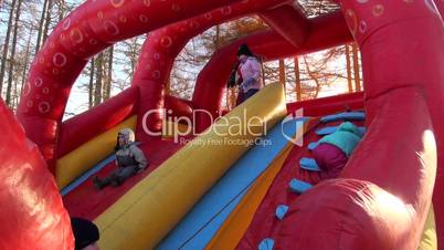 Children on an inflatable trampoline