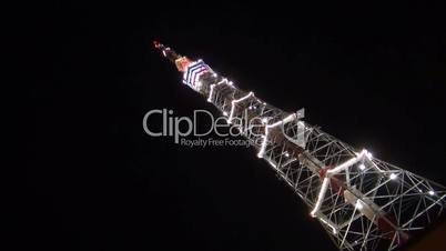 television tower at night decorated with fires