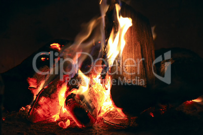 bright fire in the fireplace. burning wood photographed close.