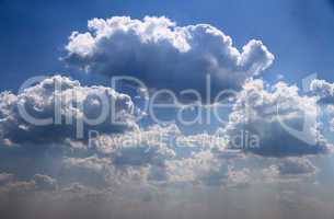 bright blue sky with puffy white clouds.