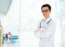 Asian doctor standing at hospital corridor