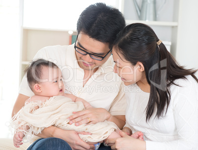 Parents pampering baby