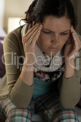 Young woman suffering from headache